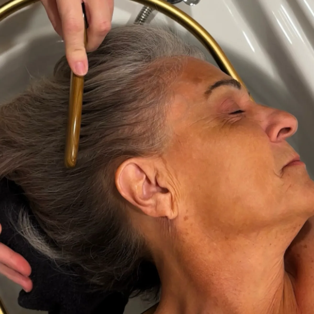 Close-up of a scalp being sectioned and assessed during a Sanctuary ritual